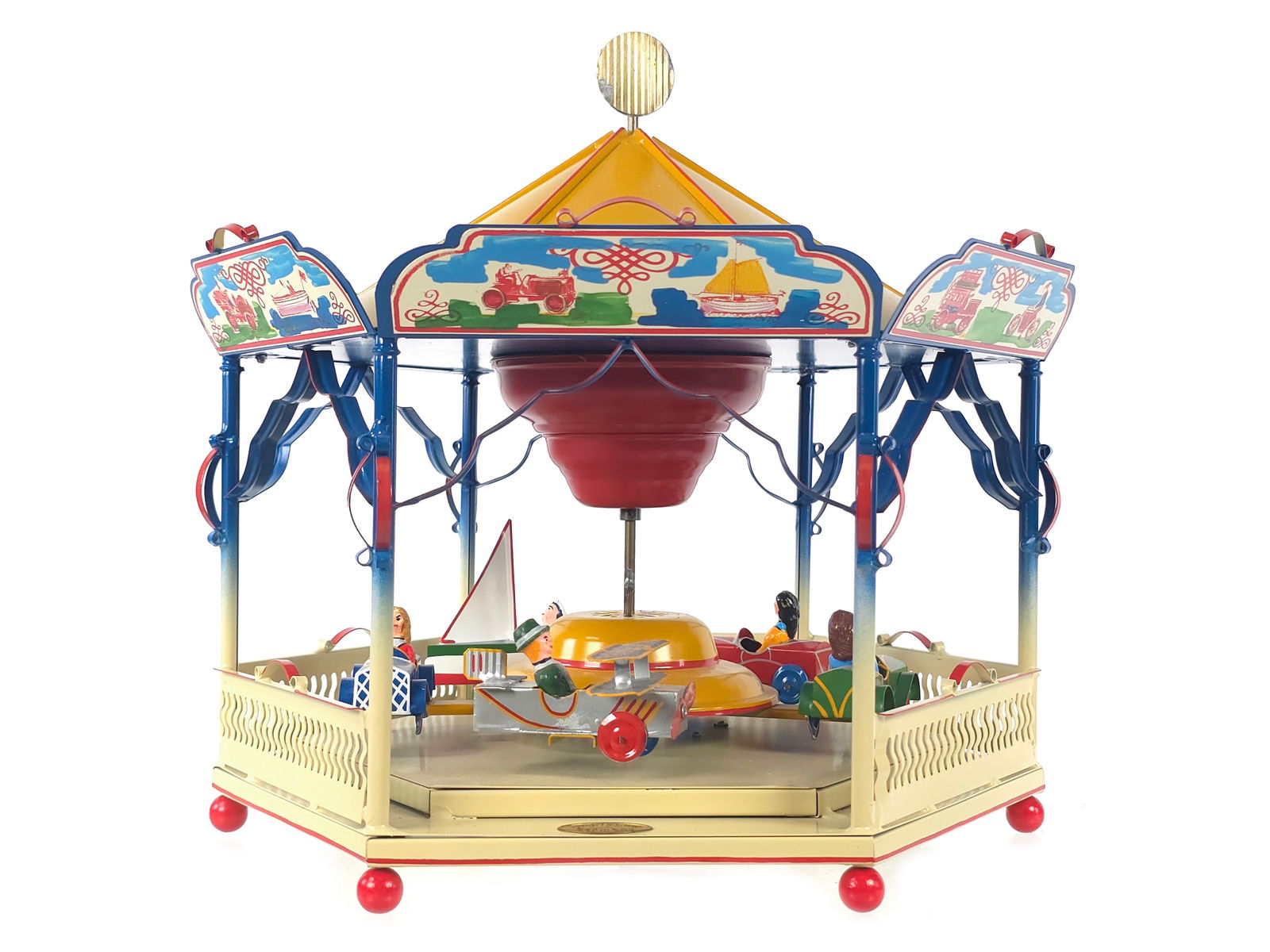 Tucher and Walther German Tin Merry-go-Round: Large-scale tin Merry-Go-Round circa 1980s by Tucher and Walther of Germany, one of the last hand-made tin toy companies. This outstanding hand-painted example includes cars and ships that move as