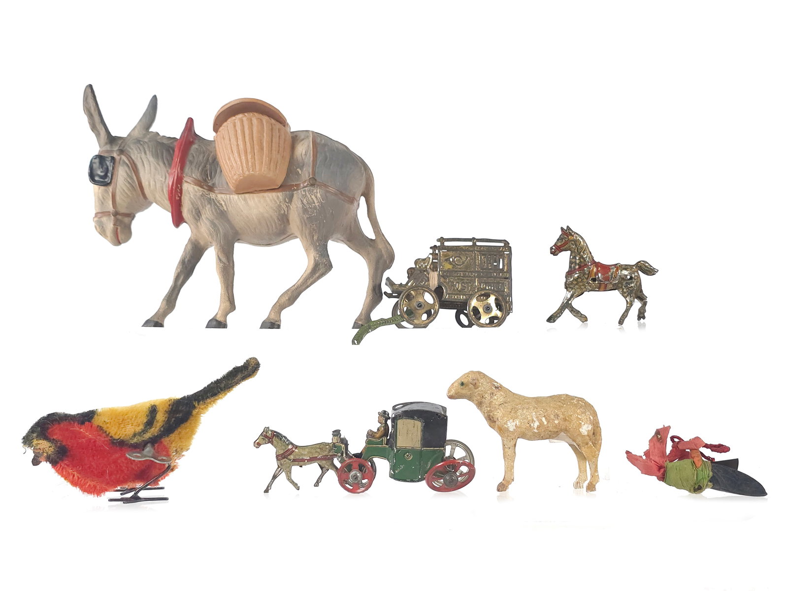 (7) Fanciful Animal and Penny Toys: German tin penny toy and animal toy lot of seven. The toys measure between approximately 2" and 7" L and between 2" and 4" H.