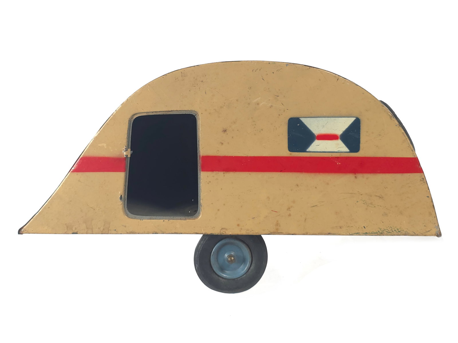 Unusual Citroen Camper Tin Trailer in Tan: Unusual rounded auto camper trailer made in France by Citroen. The toy is hand-painted and features a stenciled license plate reading “735-RK.” One door is present but needs reattachment. It m
