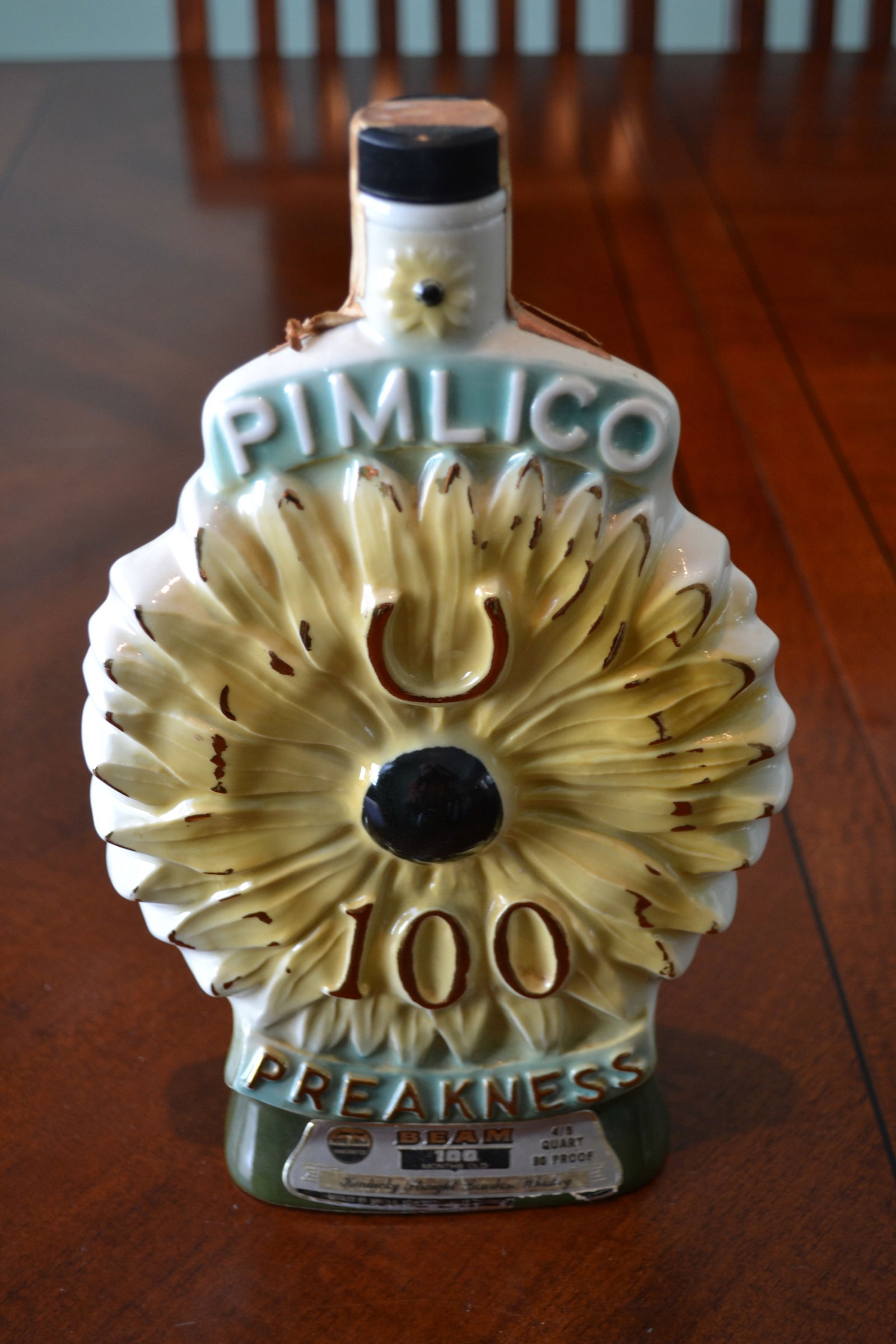 Pimlico Race 100th Preakness Whiskey Decanter 1975: Jim Beam Pimlico 100th Running of the Preakness Souvenir Whiskey Decanter 1975. Decanter is empty, colors are vibrant no discernible chips, Silver beam hundred months old label is in good shape as it