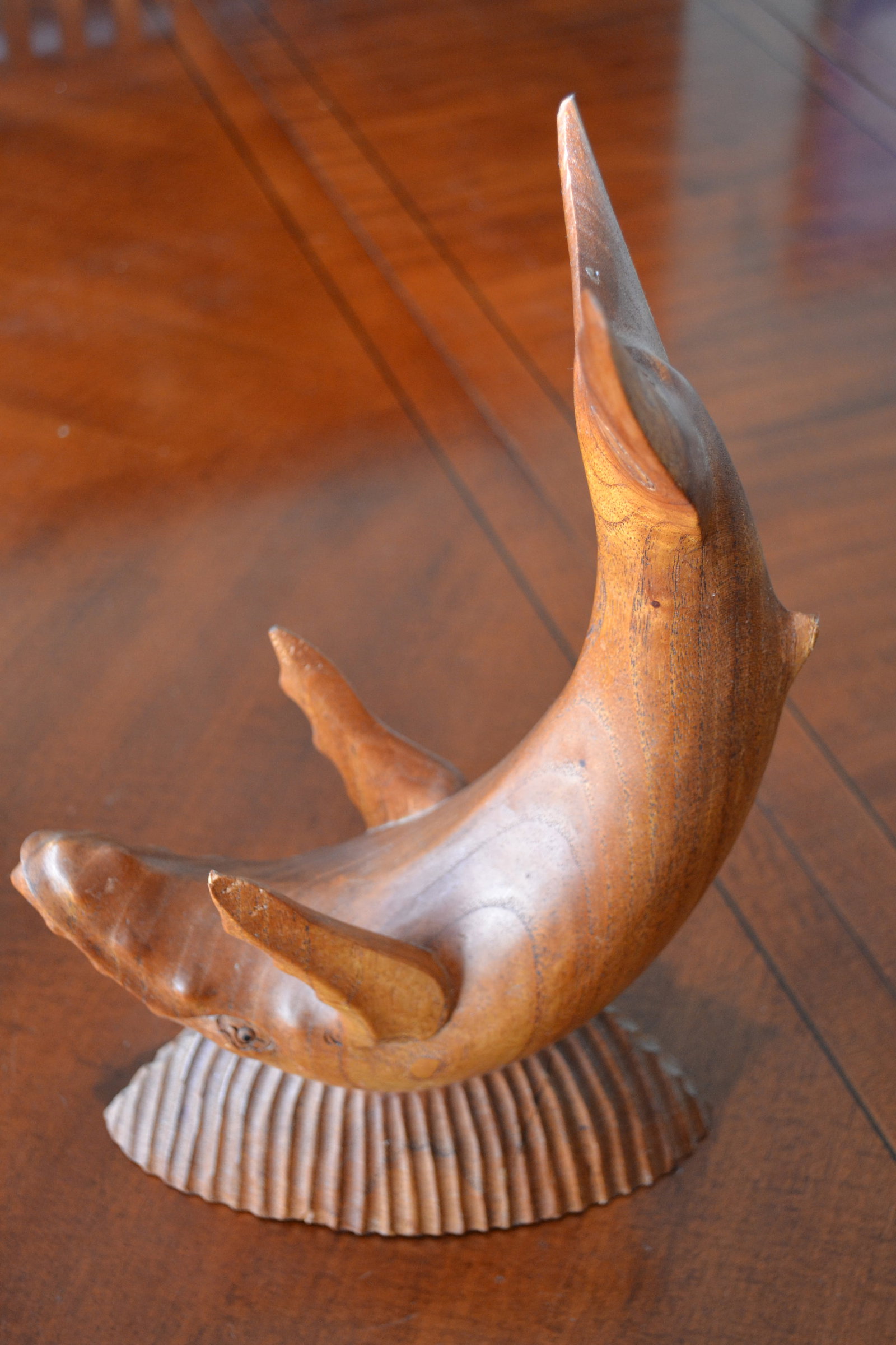 Teak Wood Carved Humpback Whale one piece: Teak Wood Carved Humpback Whale carved from one piece of wood. Unsigned Unknown Artist. In Fine condition. Base shows a minor crack in wood see photo. Measures 9 inch W x 4 inch D x 14.5 inch Height