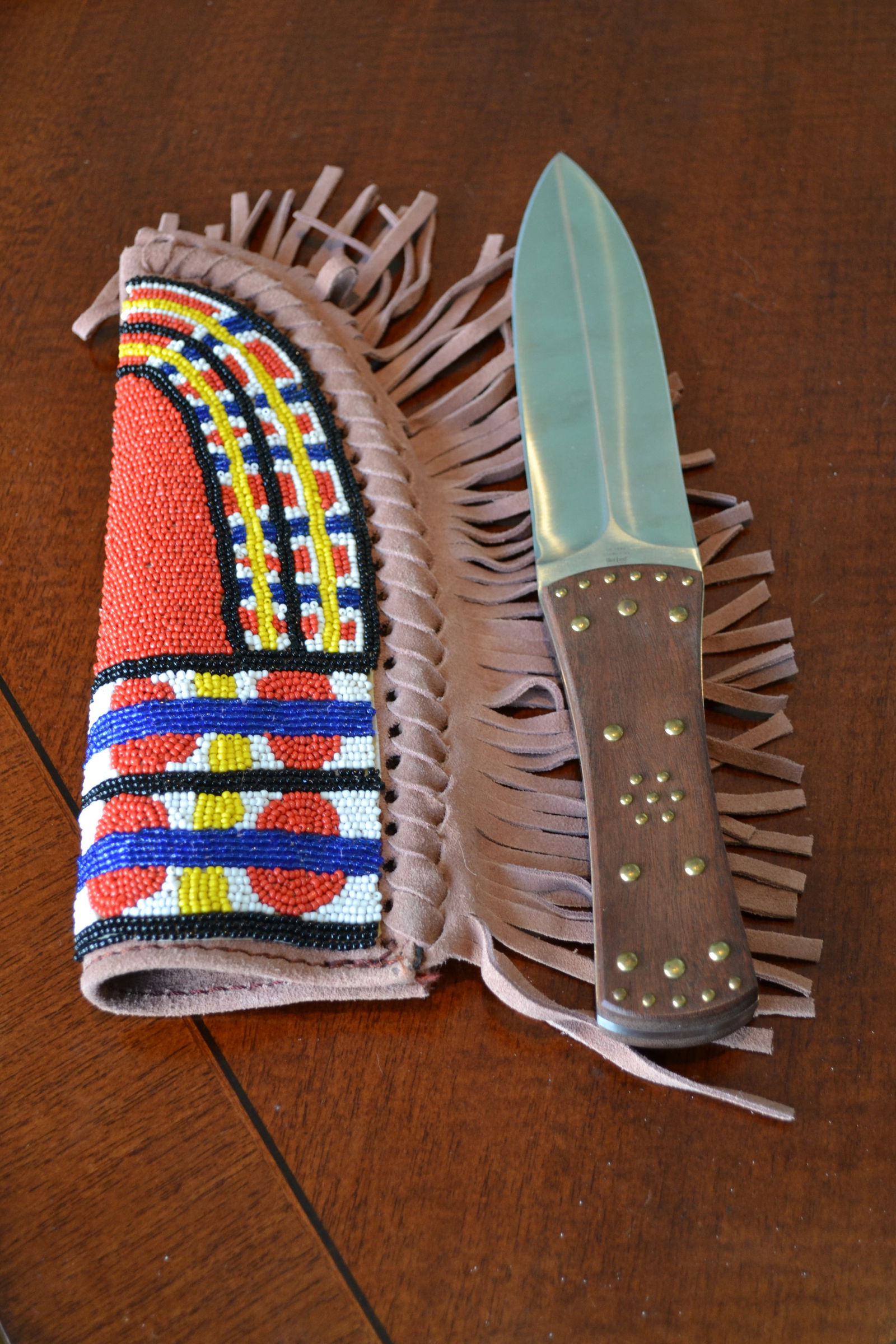 United Cutlery Plains Indian Dagger Beaded Sheath: United Cutlery Plains Indian Dagger with Beaded Leather Sheath A United Cutlery Plains Indian dagger with beaded leather sheath. Model UC 1440. 7â€™ blade. 12 1/4â€™ overall length. Ne