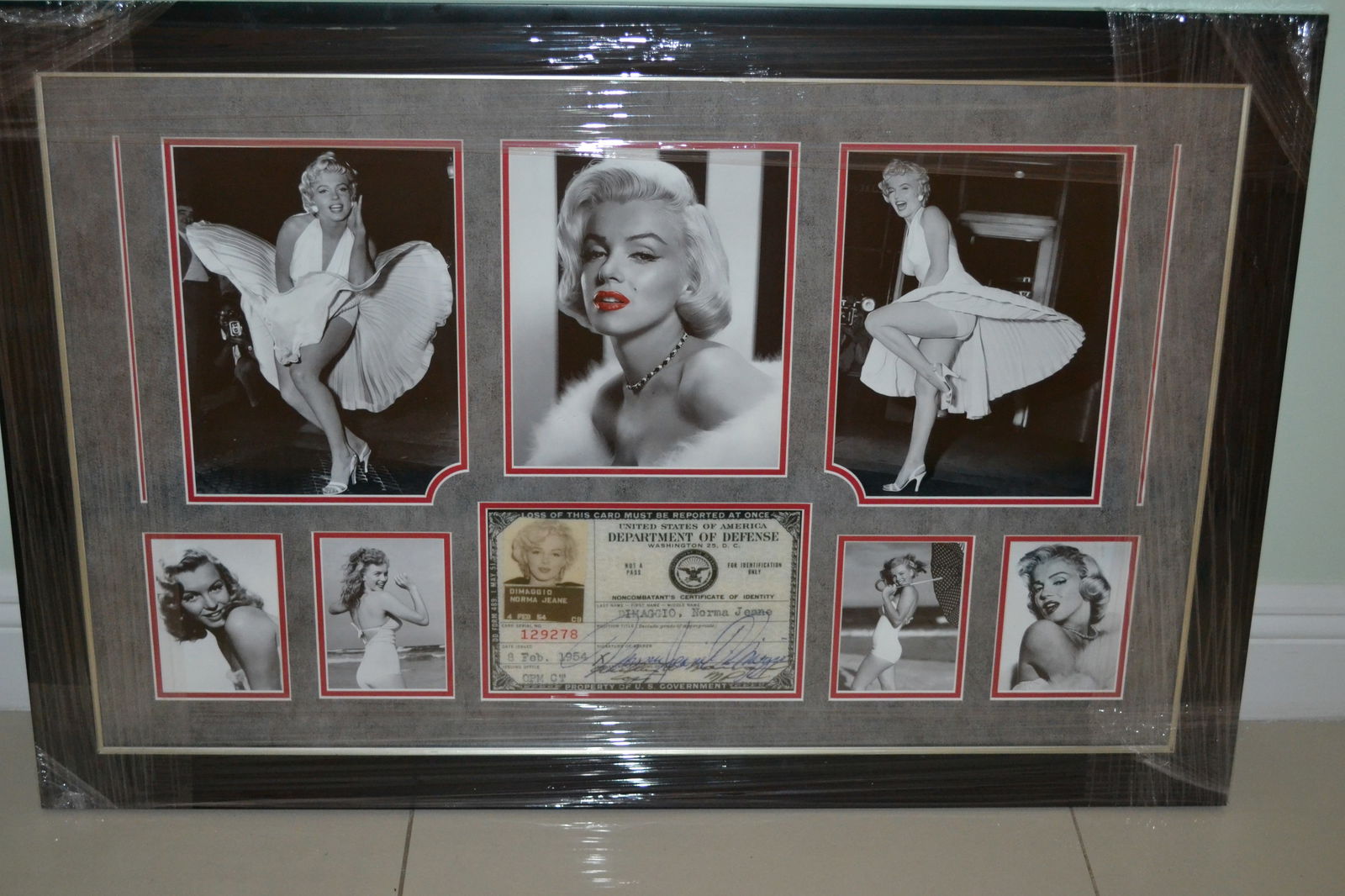 Marilyn Monroe Photo Collage w/ DOD Identity Card: Marilyn Monroe Photo Collage with Department of Defense Identity Card.Photograph prints of Marilyn Monroe at different ages in her career. Professionally framed beautifully double mat. Measurement Fra