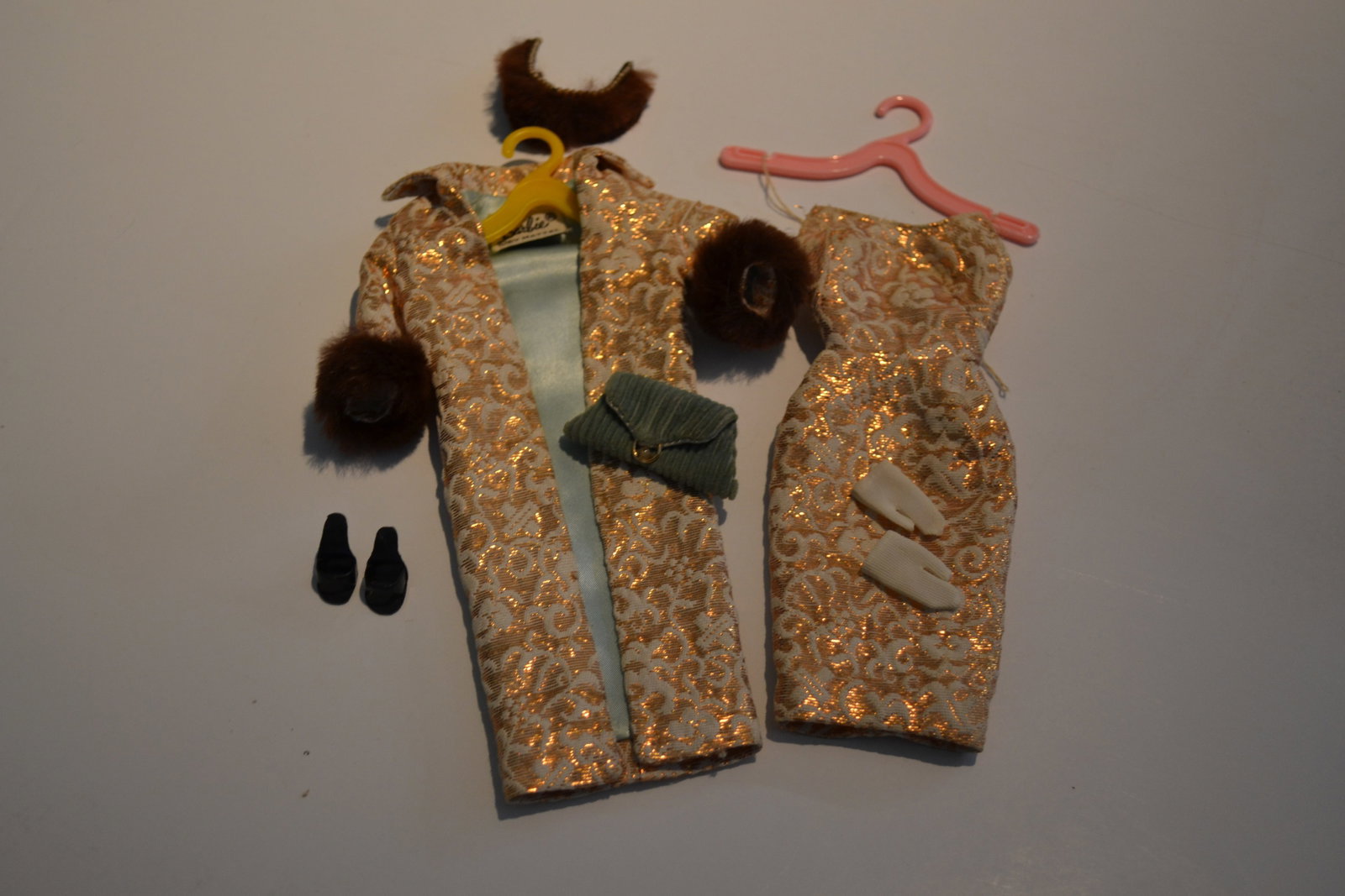 Mattel Barbie Evening Splendor #0961 Outfit 1960s: Mattel Barbie Evening Splendor #0961 Outfit 1960s Glamorous ensemble of white and gold lame. Coat has fur cuffs, is completely lined. Strapless sheath of same exciting lame. Velvet bag short white glo