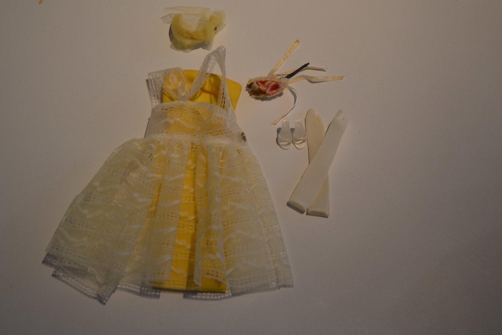 Mattel Barbie Orange Blossom 987 Outfit 1960s: Mattel Barbie Orange Blossom 987 Outfit 1960s Ensemble Barbie blossoms out for a wedding or graduation party in a buttercup yellow sheath frosted with an embroidered sheer nylon overskirt. Veiled tull