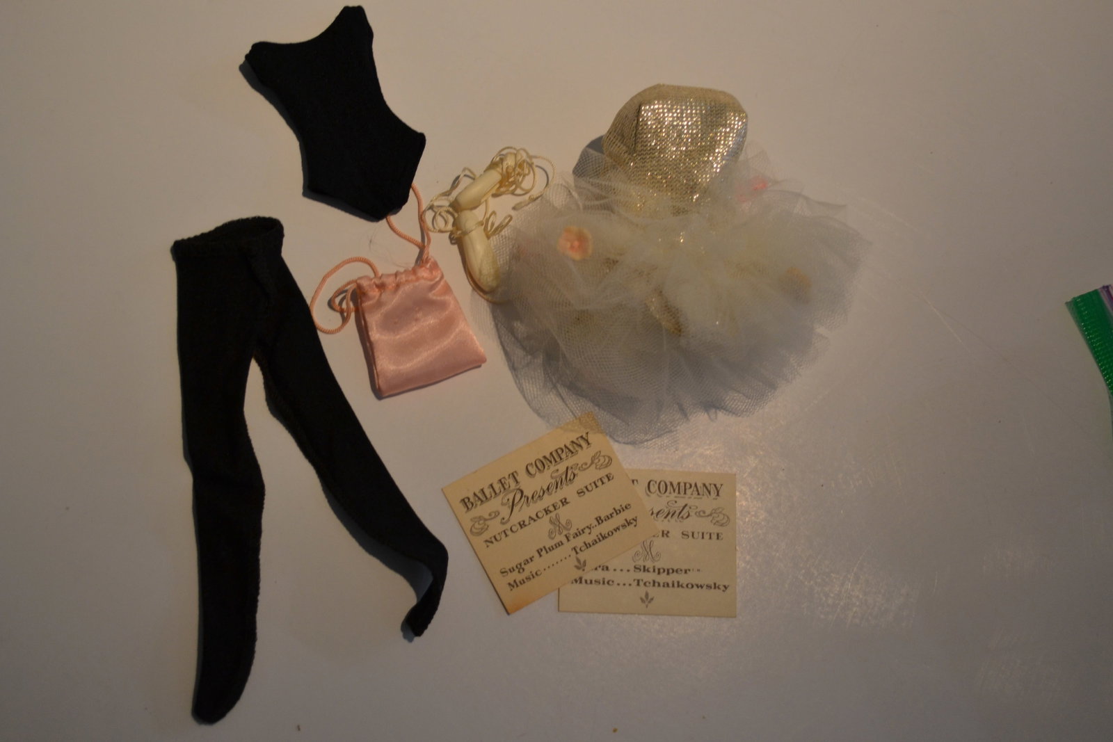 Mattel Barbie Ballerina 0989 Outfits 1960's: Mattel Barbie Ballerina 0989 Outfits 1960's Barbie dances, costumed in a shimmering silver tutu (missing tiara) For practice at the barre, she wears a black jersey leotard and tights. Pink satin shoe 