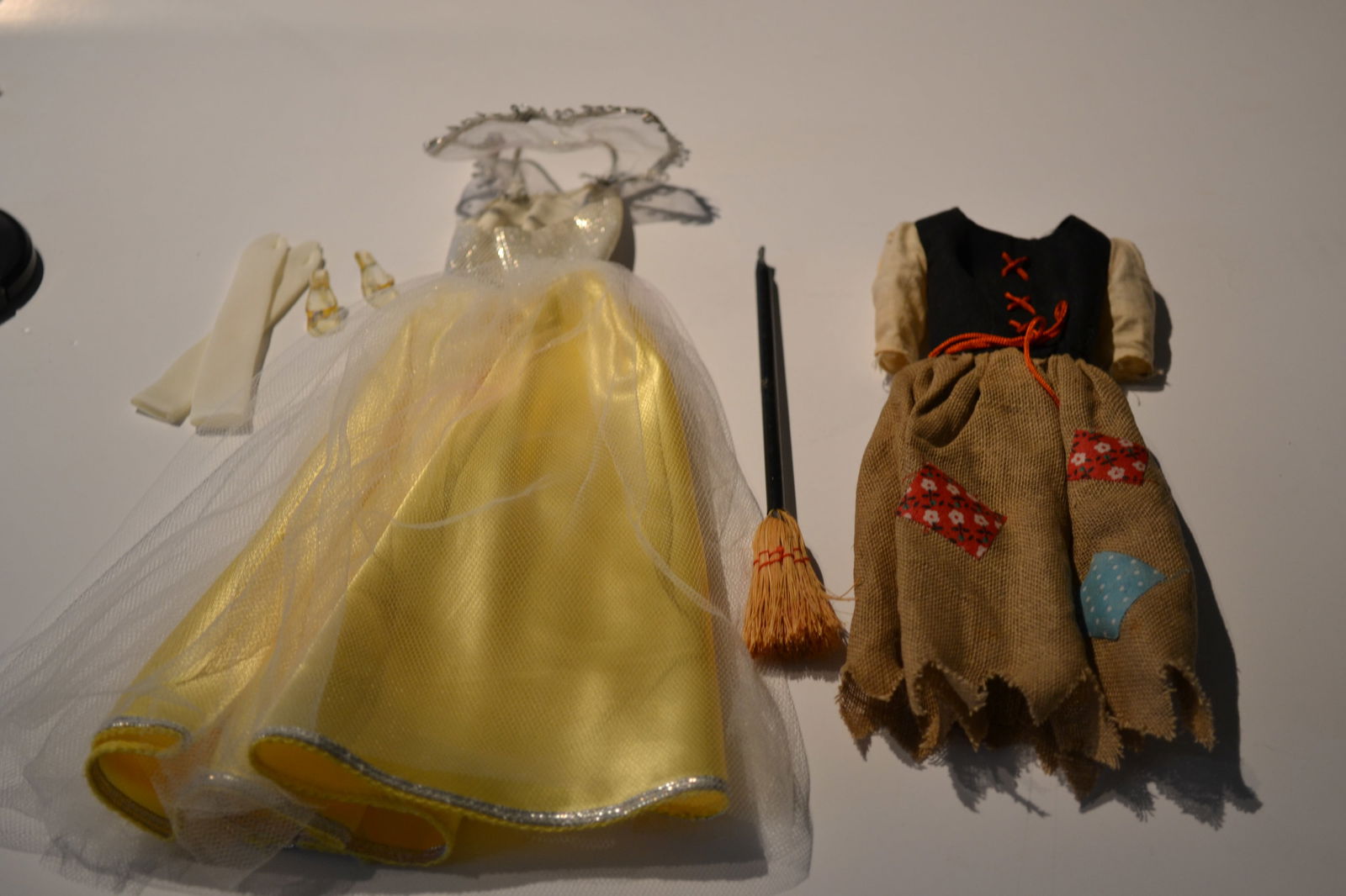 Vtg. 1963 Barbie Outfit Ensemble Cinderella #0871: Vtg. 1963 Barbie Outfit Ensemble Cinderella #871 from Barbie & Ken Little Theatre Ensemble Barbie starts with a patched dress and broom then she's off to the ball in her silver lame and yellow satin a