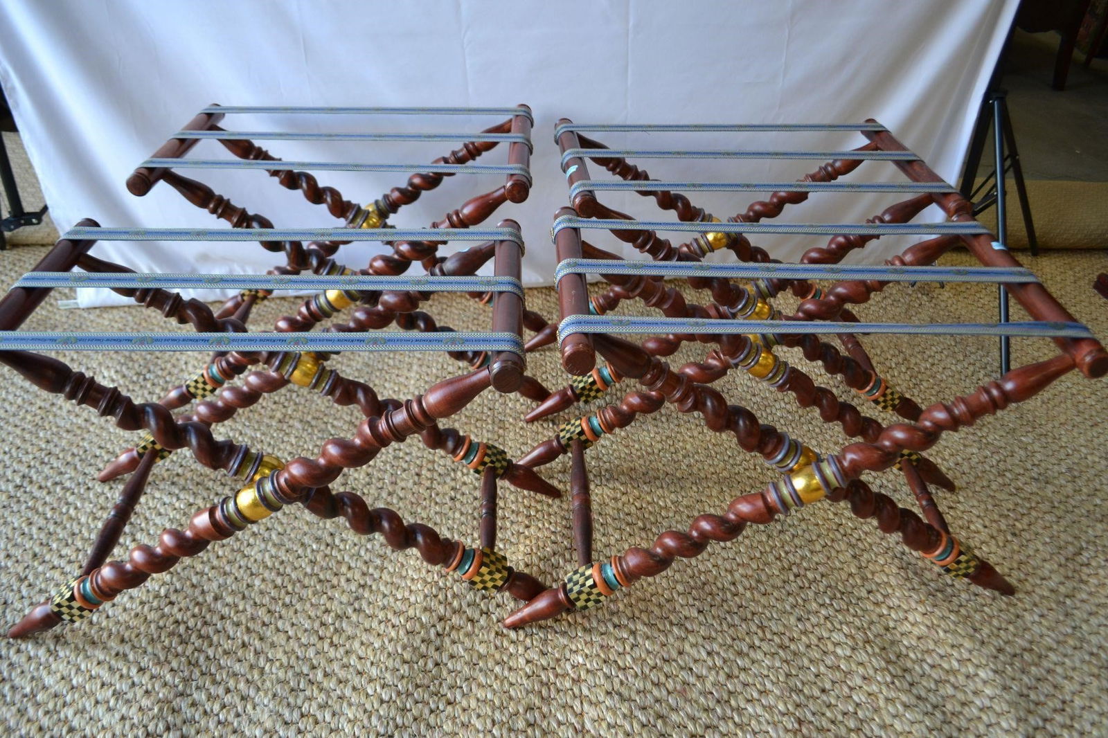 MCKENZIE CHILDS LUGGAGE RACKS SET OF 4: MCKENZIE CHILDS LUGGAGE RACKS SET OF 4 Barleycorn turned wood legs with paint decoration. Mckenzie Childs straps. -- Dimensions: H: 19.5 inches: W: 24 inches: D: 15 inches