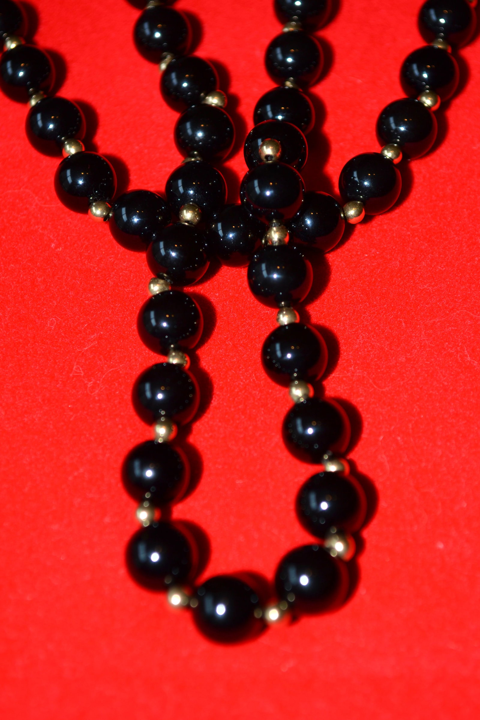 28" Genuine Black Onyx & 14K Gold Bead Necklace: Vintage 28" Genuine Black Onyx & 14K Gold Bead Necklace. Each Onyx bead is separated by a 14K Gold bead on a continuous thread; no Clasp 72 Onyx beads Size 8mm and 73 Gold beads Size 3mm In Excellent 