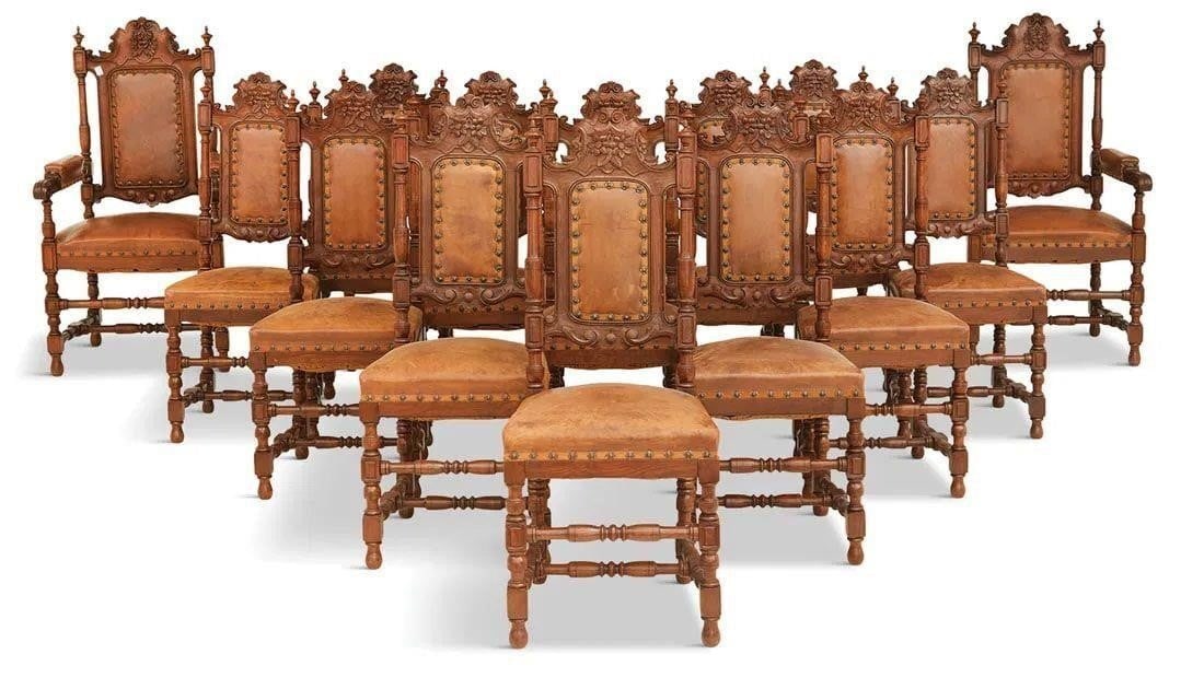 Fourteen Continental Neo- Renaissance Oak Chairs: Fourteen Continental Neo- Renaissance Oak Chairs Suite of fourteen Continental Neo-Renaissance Carved Oak Chairs fourth quarter 19th Century Each with a floral carved back crest above a central padded