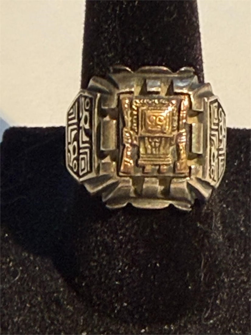 Peruvian Viracocha Inca Sterling Silver & 18k Gold: Vintage item is a Peruvian Incan style ring, often featuring a gold-overlay design depicting an Incan deity such as Viracocha on a sterling silver band. Sometimes referred to as a Biker Ring Stamped 9