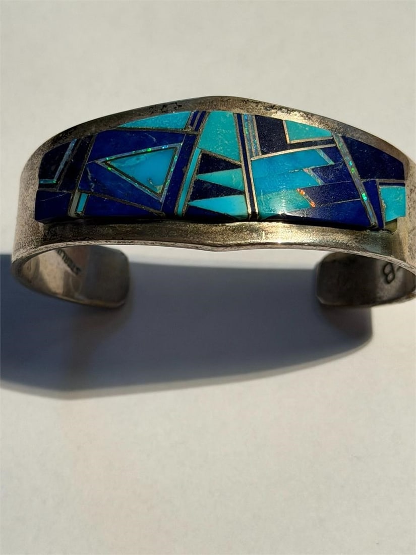 Vintage Navajo SS Turquoise Cuff Bracelet EB stamp: Vintage handmade Navajo sterling silver cuff bracelet featuring a geometric inlay of turquoise and lapis lazuli made by Edward Becenti Stamped EB Sterling His pieces are not only decorative but serve 