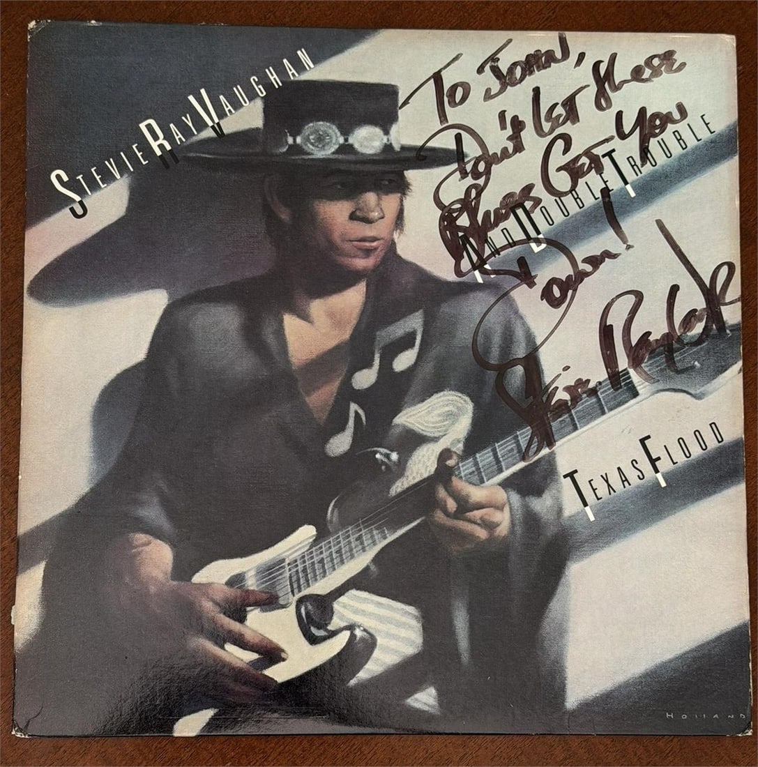STEVIE RAY VAUGHAN Autographed Texas Flood Album: STEVIE RAY VAUGHAN Signed Autographed Promotional Debut album "Texas Flood" signed and inscribed on the front cover in black felt tip, "To John, Don't let these Blues Get You Down! Stevie Ray