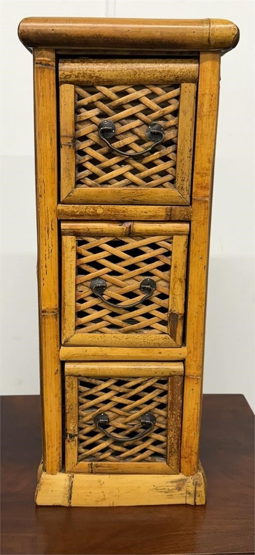 Vtg Bamboo and Woven Sattan small chest of drawers: Vintage bamboo and woven rattan small chest of drawers, commonly found in styles like Hollywood Regency or Bohemian decor. Measures 9 1/2"D x 8 1/2"W x 23"H