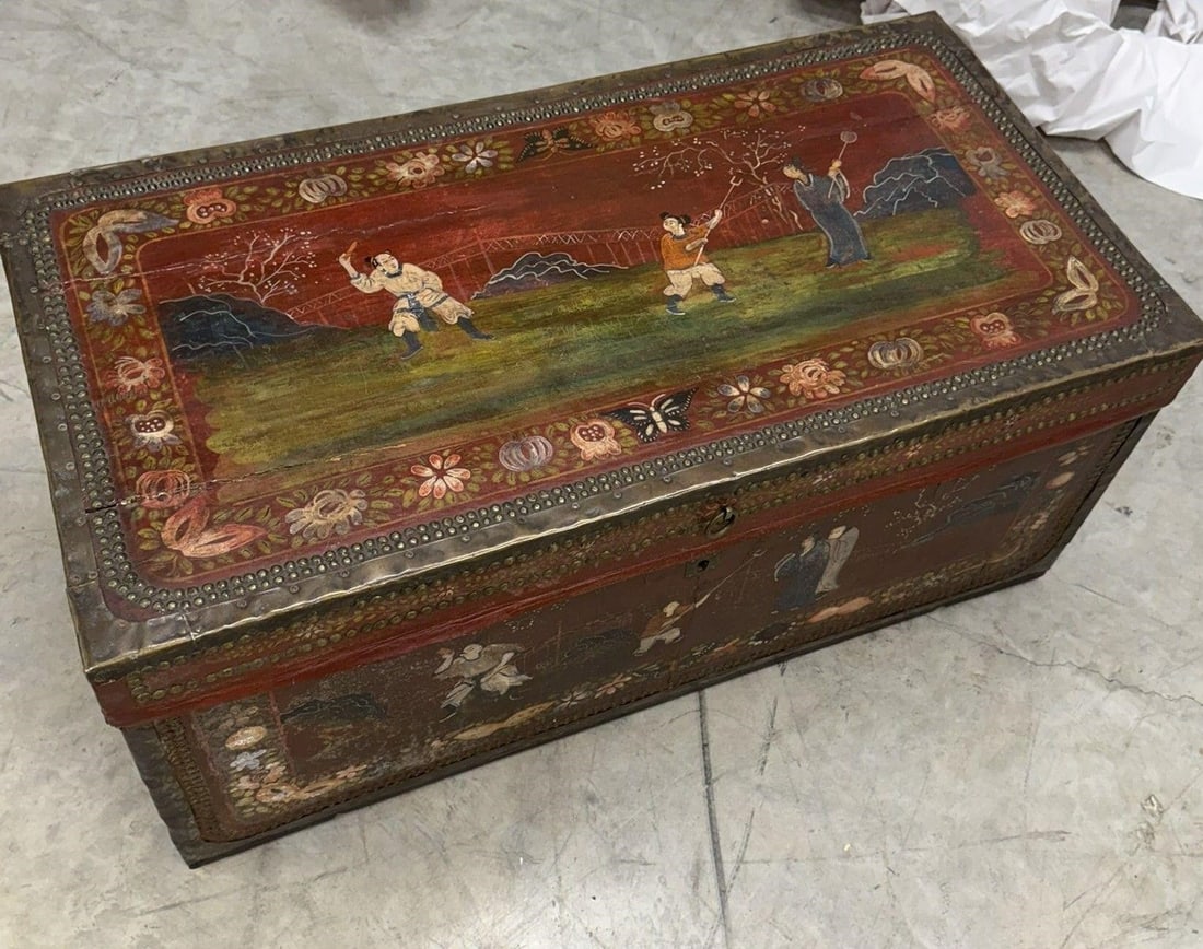 Chinese Export Camphor Wood Trunk with Key: 19th-century Chinese export camphor wood trunk, often referred to as a "China Trade" trunk, which features red leather cladding and hand-painted figurative scenes within floral borders with Key Note