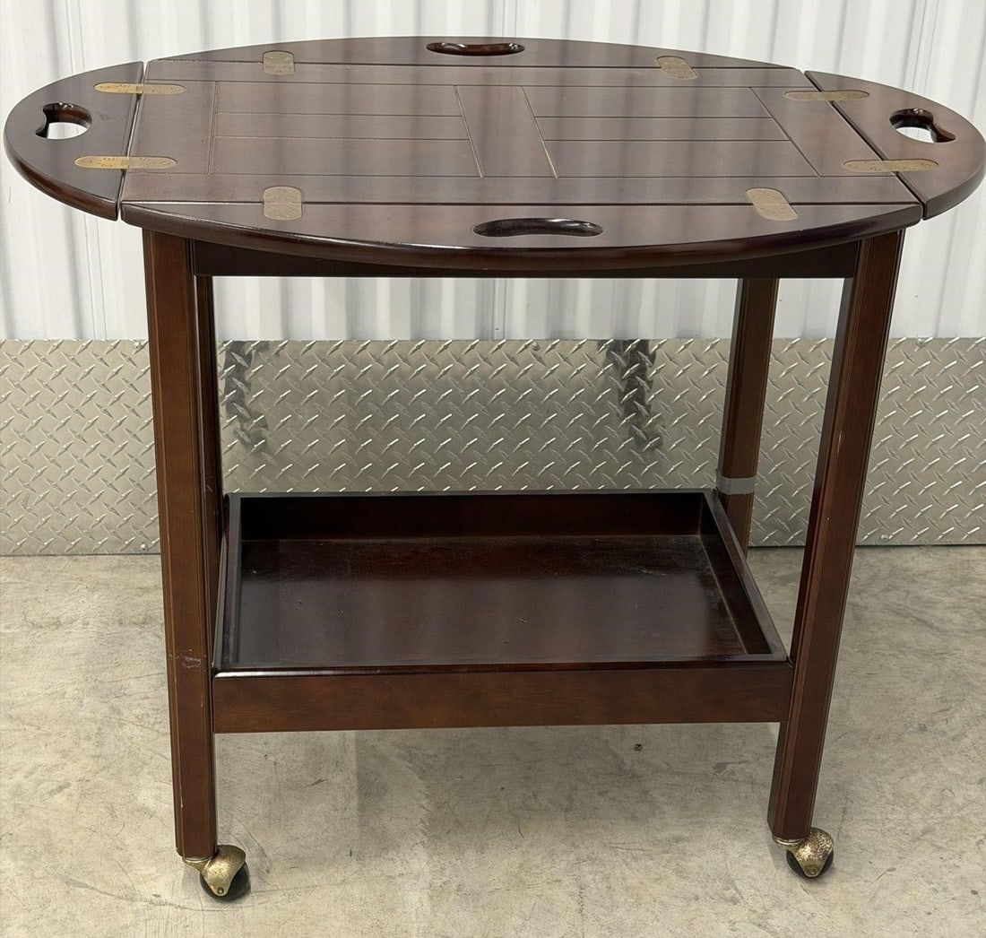 Butler Table or Bar Serving Cart on Roller Bombay: Vintage Chippendale-style mahogany tea bar serving cart manufactured by The Bombay Company on rollers. Butler Table or Bar with Lower Shelf is a stylish and versatile piece of furniture for any home. 