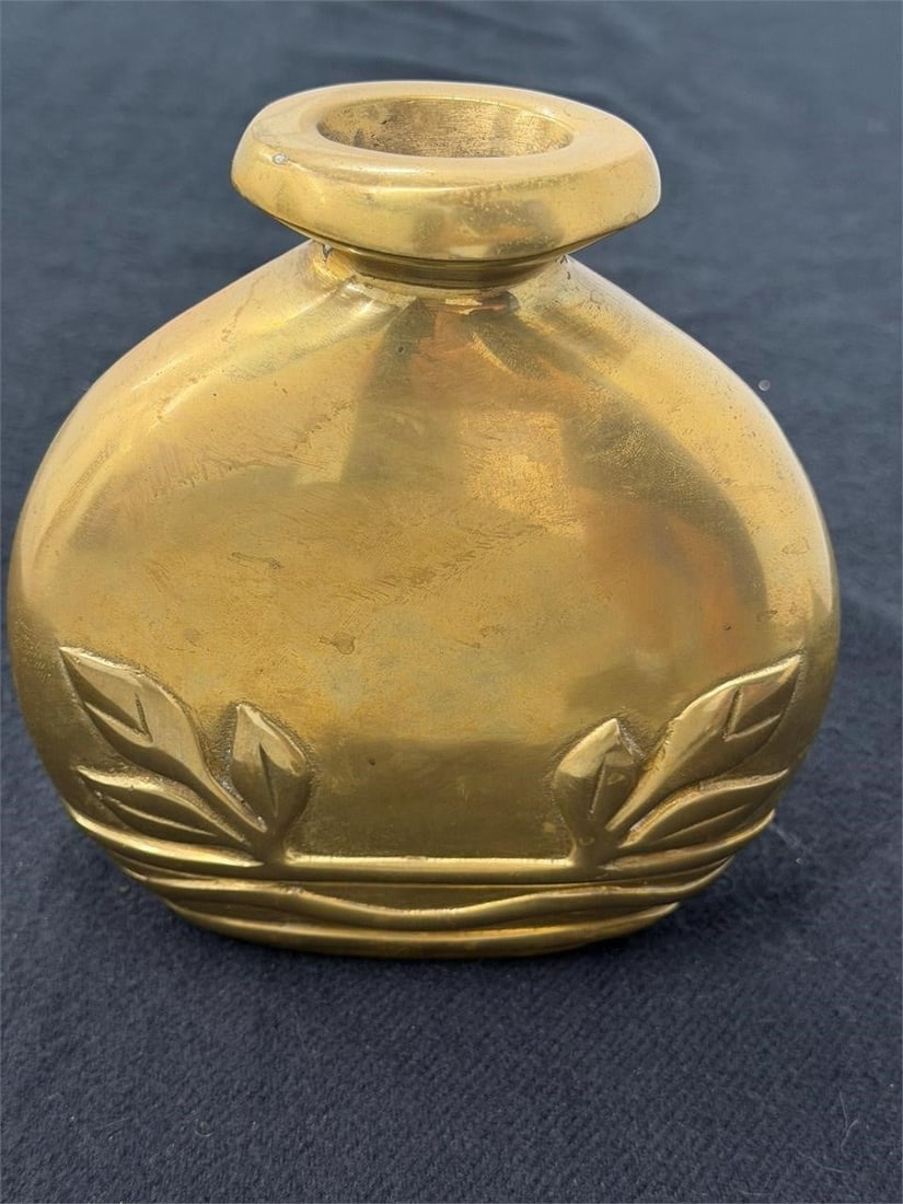 Vintage Art Deco Brass Vase by Dolbi Cashier: Vintage brass vase is a decorative item produced by Dolbi Cashier, a brand of Gallery House Inc. known for its Art Deco revival style with a sculptural, Oblong Oval Flask shape. Marked made in Korea. 