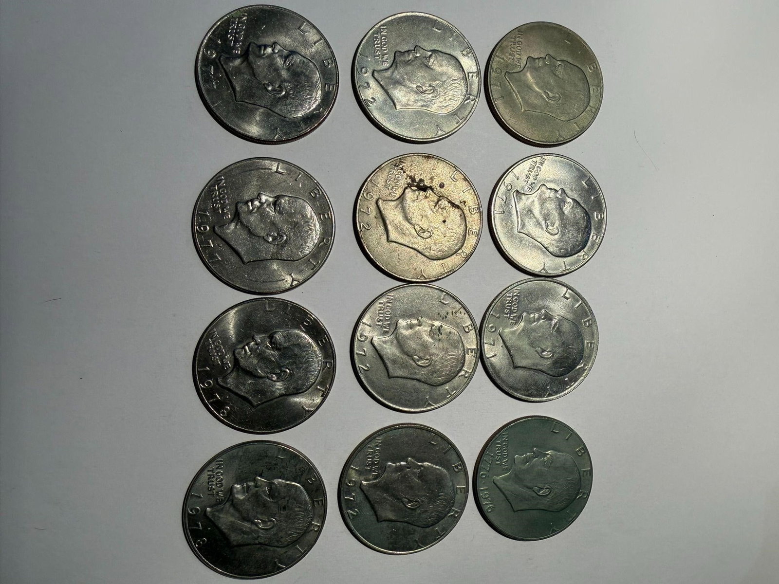 Eisenhower 1971-78 Clad Composition Dollar Lot 12: Eisenhower 1971-78 Clad Composition One Dollar Lot of 12Dates: 1971 (3)1972 (4)1977 (2)1978 (2)1776-1976 (1)