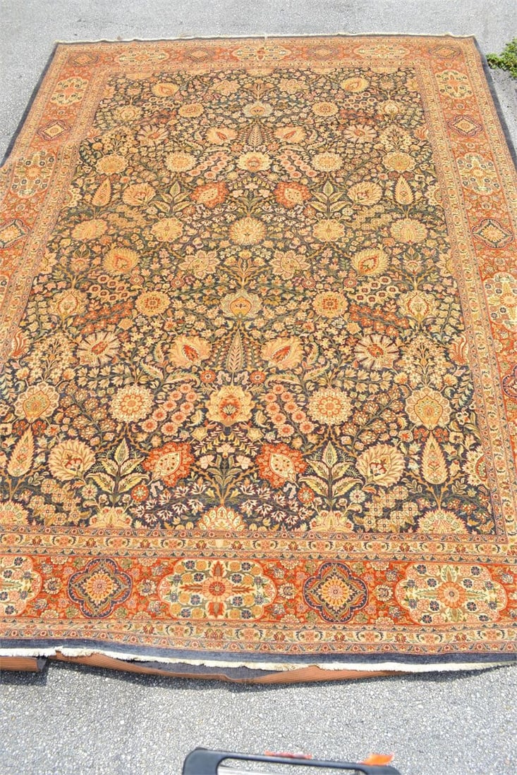 LARGE WOOL AREA CARPET WITH FRINGE TRIPLE BORDER: LARGE WOOL AREA CARPET WITH FRINGE Triple border carpet with a traditional plant and flower pattern. Natural colors of Charcoal, Navy, Orange, Cream, Gold and Green are beautiful together. Measures 13