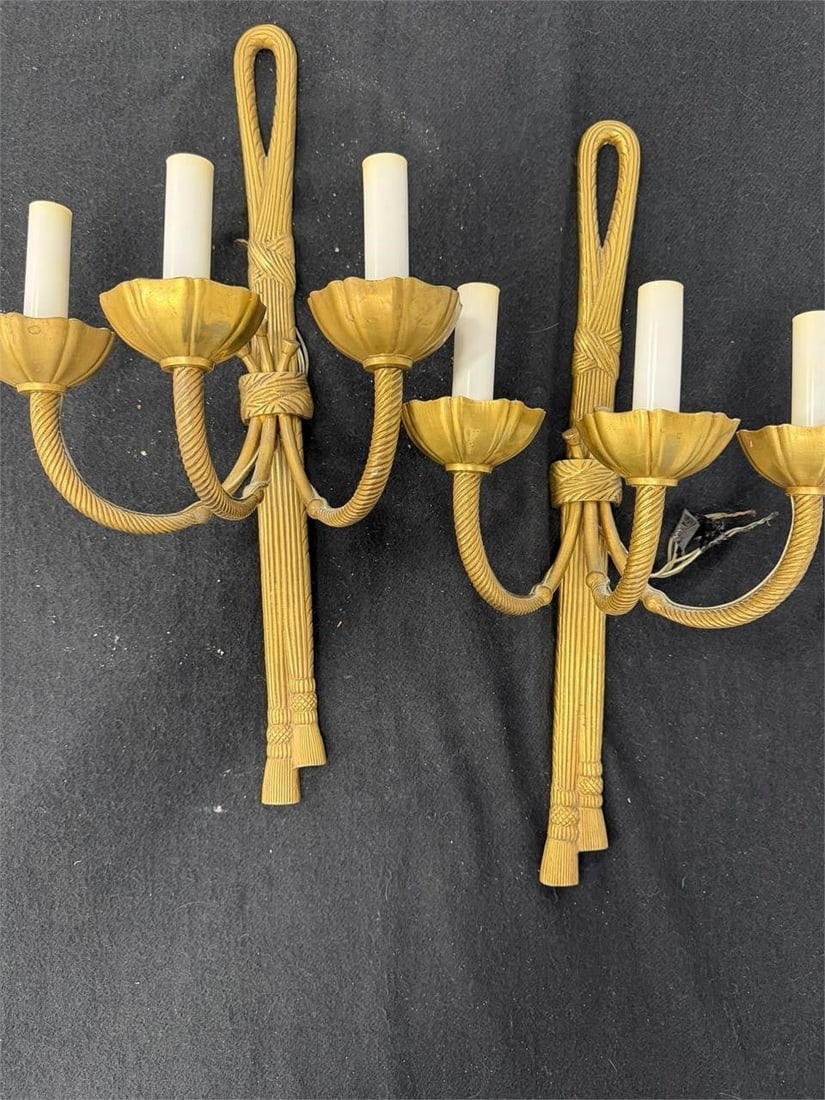Vintage Pair French Louis XVI Style Wall Sconces: Pair of vintage French Louis XVI style wall sconces featuring a neoclassical knotted ribbon and tassel design. Solid brass with a gilded or gold finish Features two arms designed to look like rope, 3 