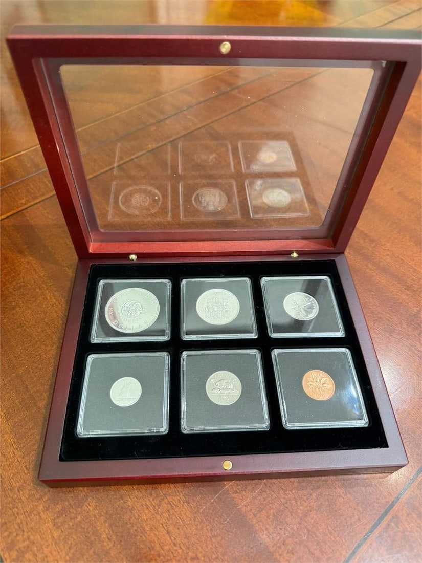1964 Proof Like Set of Four Coins in Mahogany Box: 1964 Canadian uncirculated coin set housed in a custom mahogany display case. Contents: Includes all six denominations issued in 1964: the penny, nickel, dime, quarter, half dollar, and silver dollar.