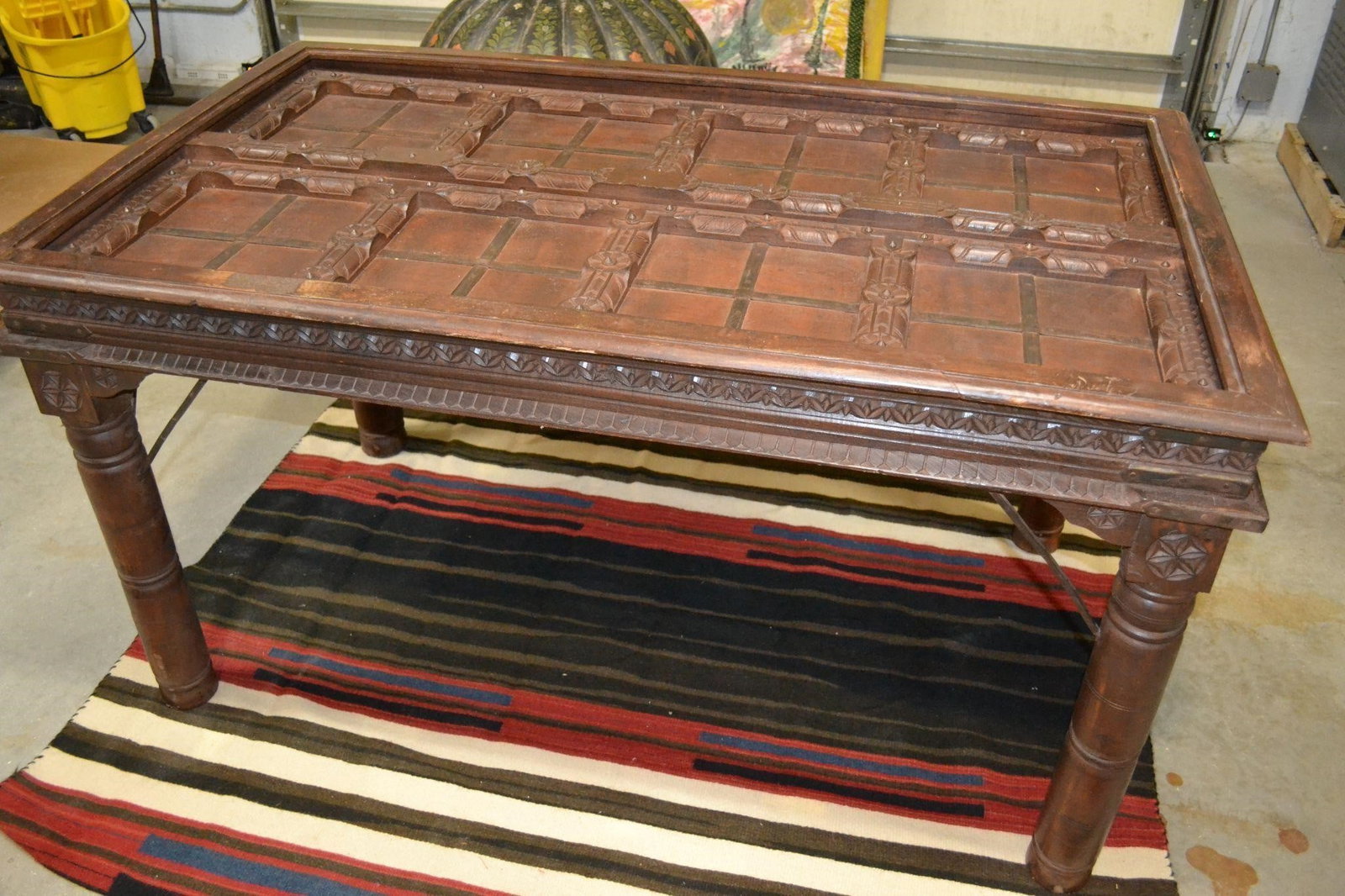 PERUVIAN CARVED DOOR DINING TABLE: PERUVIAN CARVED DOOR DINING TABLE The double panel door converted to a dining table is no longer available for import. Does not come with a Glass top inset. Measures: 58.50"L x 36"D x 32"H