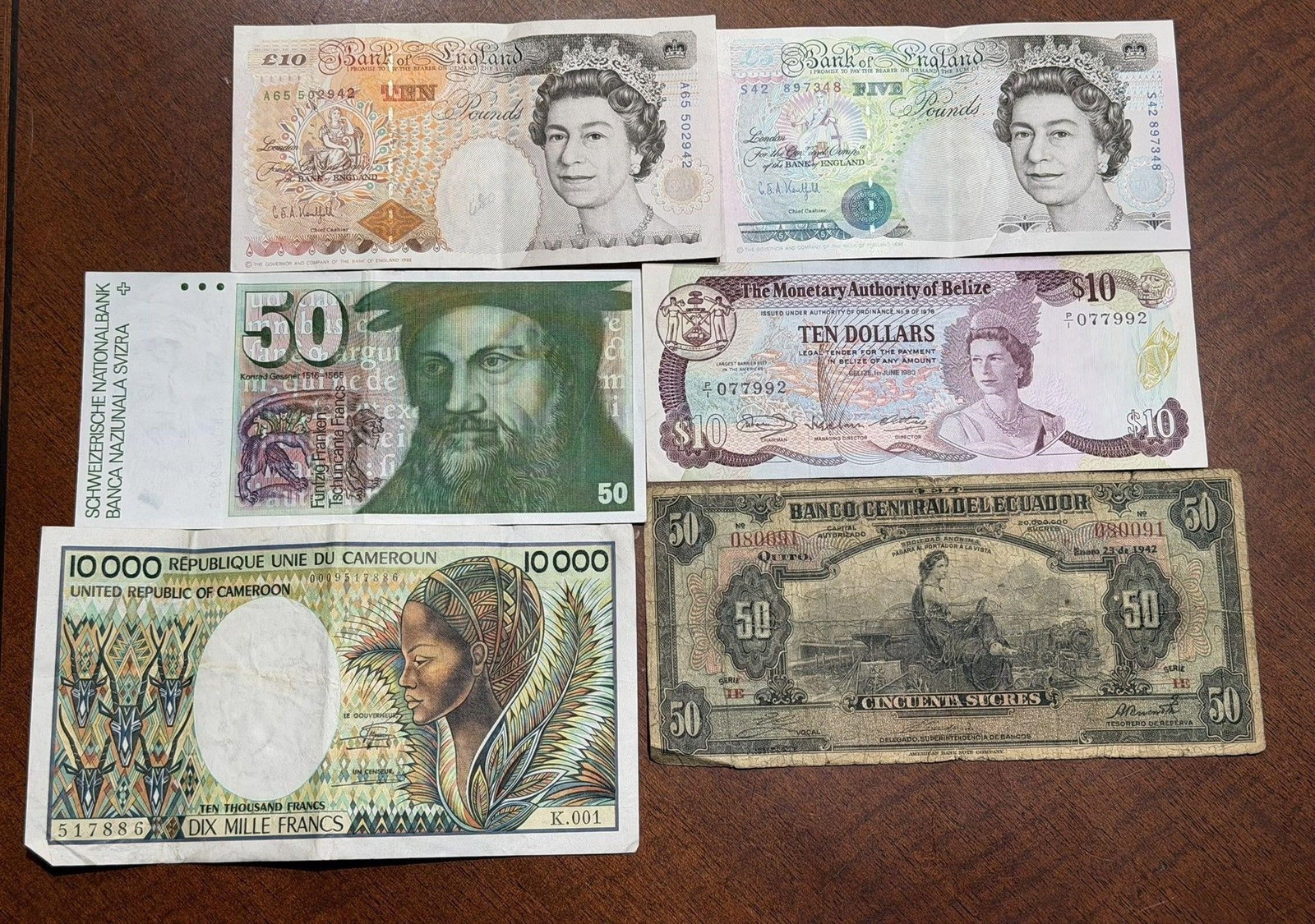 Lot of 6 Six Foreign Banknotes: Lot of Six Foreign Banknotes to IncludeBelize, (2) British, Cameroon, Swiss, Ecuador