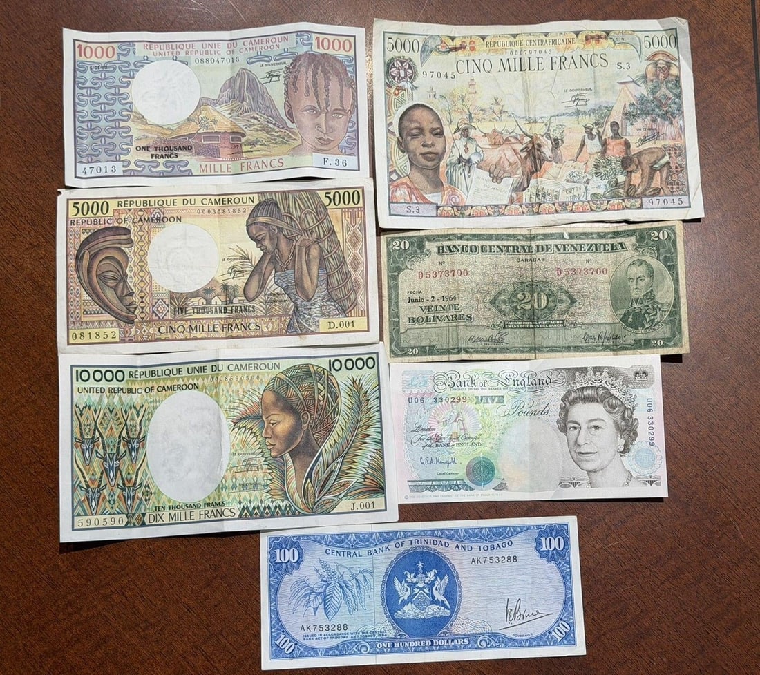 Lot of 7 Seven Foreign Banknotes: Lot of Seven Foreign Banknotes to IncludeBritish, Trinidad, Venezuela, (3) Cameroon, Central African Republic