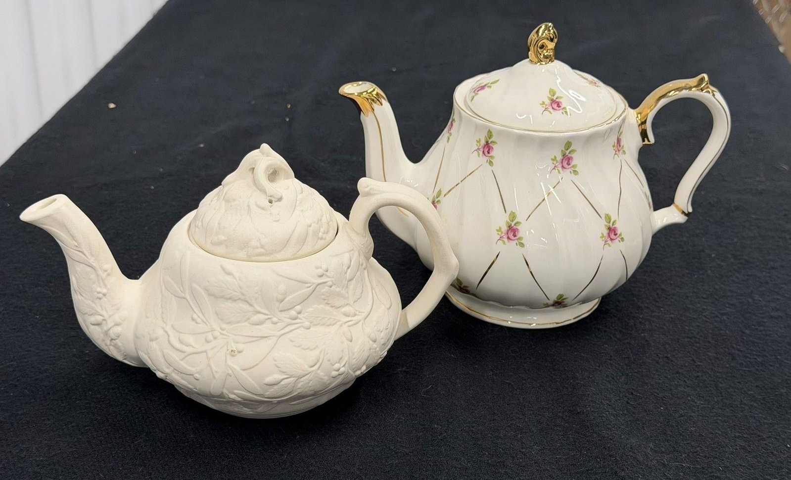 English Tea Pot Music Box and MMA Bisque Teapot: English Tea Pot Made for The San Fancisco Music Box Company in Staffordshire England and It does play. The Vintage MMA Mistletoe and Acorn Bisque Porcelain Teapot by Met Museum of ArtThe teapot measur