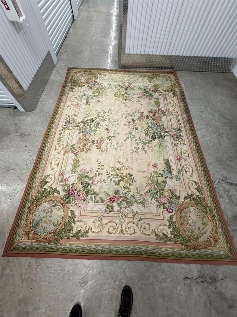 French Aubusson Rug Style Flat Weave 8'7" x 11'10": French Aubusson Rug Style or Wall Tapestry Classic creme color background accented with a floral leaf motif with open medallions on each corner and a rust trim border Measurements 8'7" x 11'10"