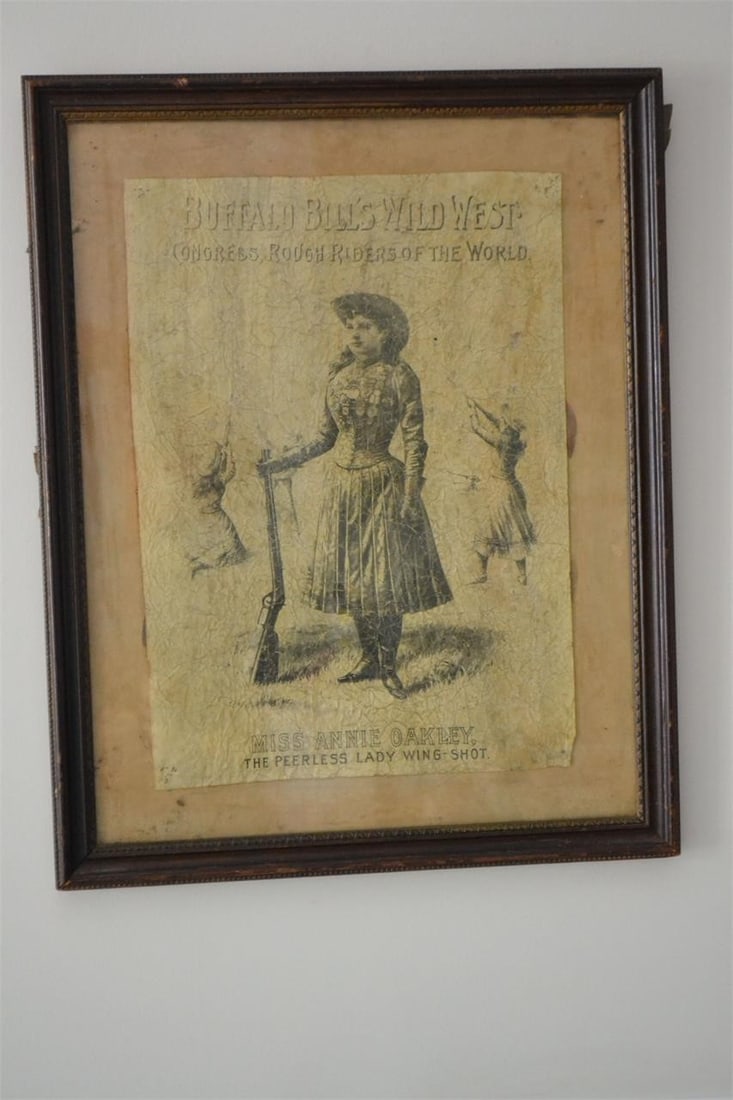 Vintage Buffalo Bills Wild West Miss Annie Oakley Ad: Vintage BUFFALO BILL'S WILD WEST CONGRESS, ROUGH RIDERS OF THE WORLD Miss Annie Oakley The Peerless Lady Wing-Shot Framed Advertisement Has pin holes in all 4 corners as if it was tacked to some other