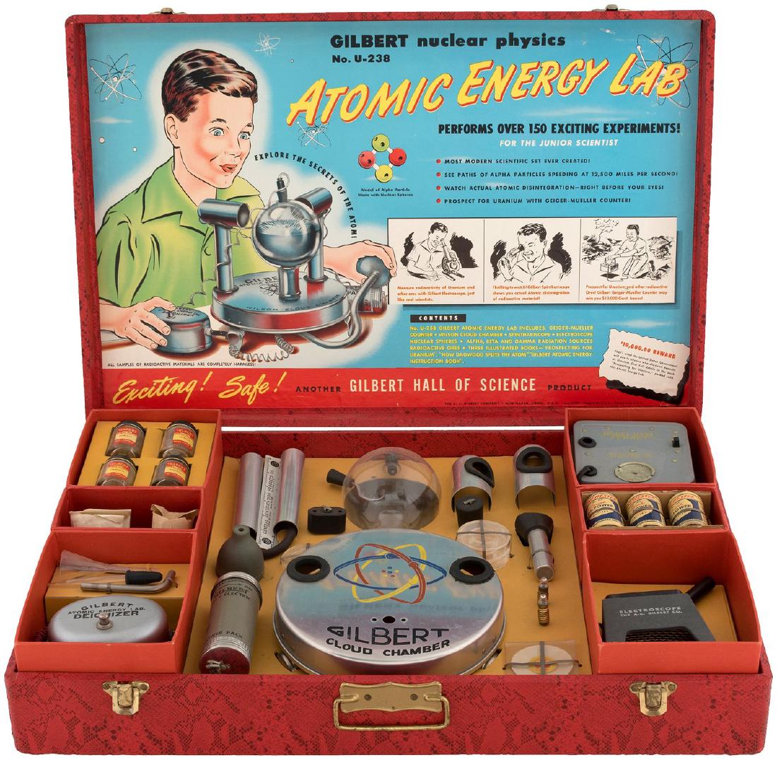 GILBERT NUCLEAR PHYSICS NO. U-238 ATOMIC ENERGY LAB" BO: 16.5x25.25x4.75" deep textured paper-covered case contains A.C. Gilbert Co. set No. U-238 (a clever reference to Uranium-238, the most common isotope of uranium found in nature). This infamous lab's i