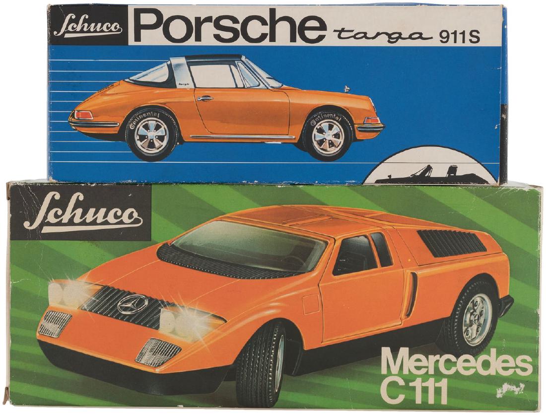 SCHUCO PORSCHE TARGA 911S & MERCEDES C 111 BOXED PAIR.: Pair of illustrated cardboard boxes contain highly detailed in 1/19th and 1/16th scale replicas, both made in Germany, 1970s. 8.5" long Porsche has plastic body over metal chassis w/steering wheel tha