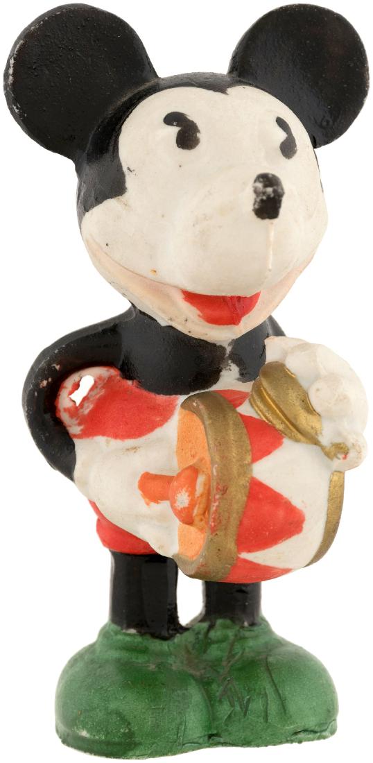 "MICKEY MOUSE" PLAYING DRUM LARGE BISQUE.: 5.25" tall marked w/incised "Mickey Mouse - © Walt E. Disney" text on backside and "Made In Japan" stamp on underside. 1930s. Complete w/aged paper label on underside. From a set of four musician bis