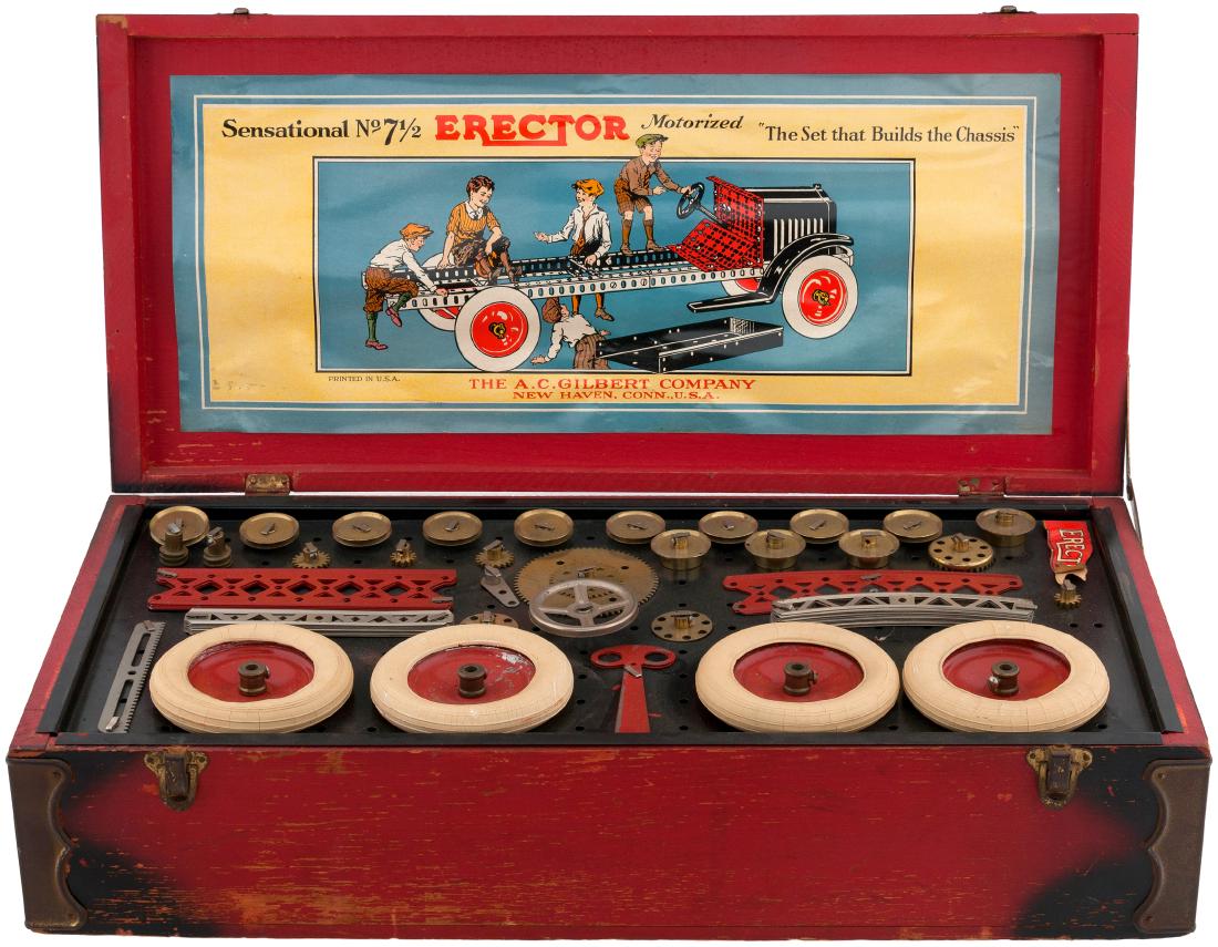 GILBERT "THE NEW ERECTOR" 1931 BOXED SET.: 10.75x22.75x5.5" deep painted wood (red w/black corners) hinged-lid box contains 1931 Erector set No. 7-1/2 by A.C. Gilbert Co. Lid features worn "The New Erector" decal. Front side of box has metal f