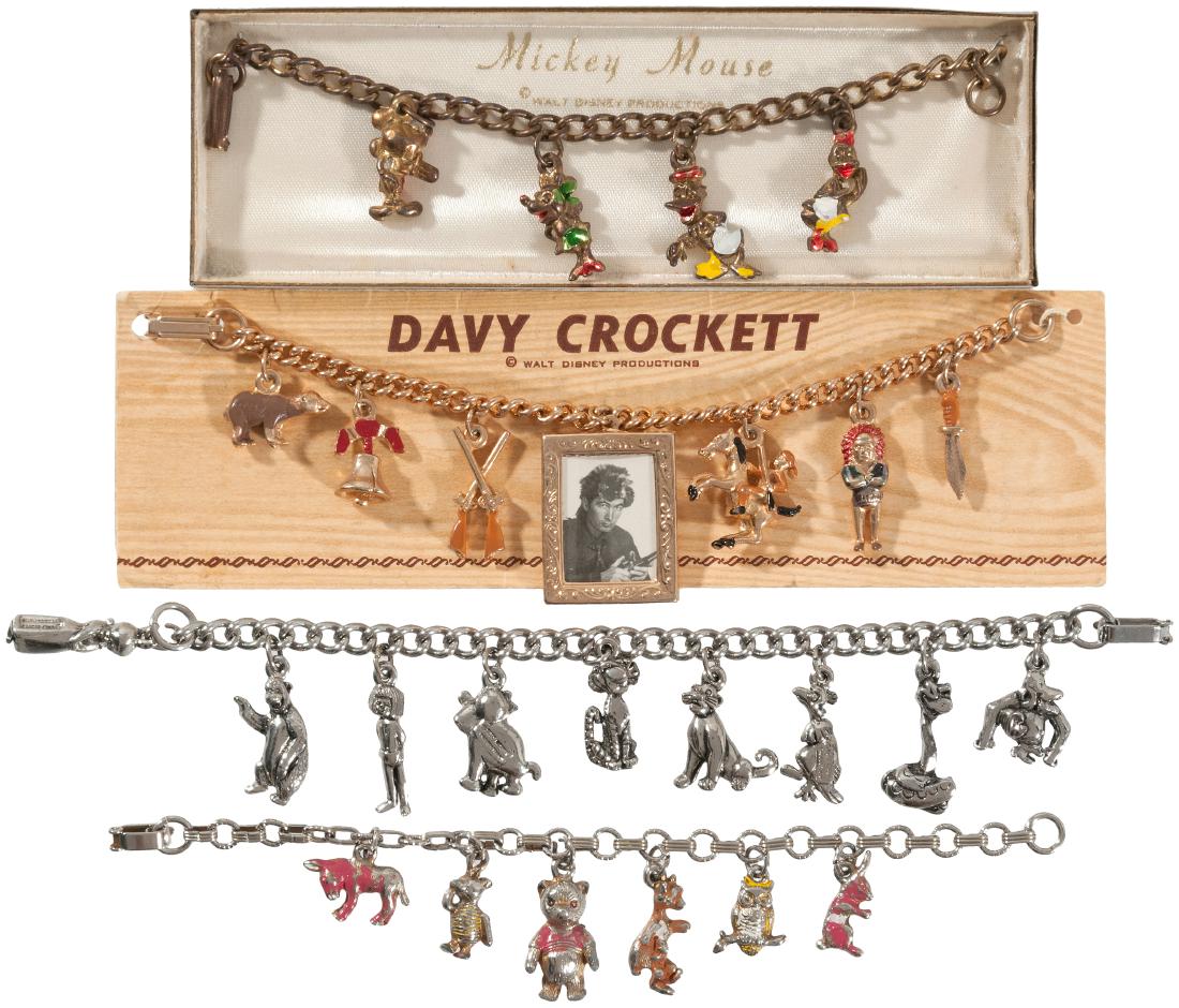 DISNEY 1950s/1960s CHARM BRACELET LOT.: Lot of four chain link bracelets, each w/cast metal figural charms (three w/painted enamel accents). Lot includes Davy Crockett (on card and featuring Fess Parker photo frame charm), Winnie the Pooh (