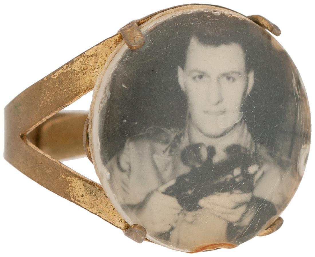 CAPTAIN VIDEO TELEVISION'S FIRST SPACE PROGRAM PREMIUM : Brass base with four small prongs holding a highly domed plastic cover over a real photo, without dot screen, of Richard Coogan in his role as the first TV space hero Captain Video. The program aired