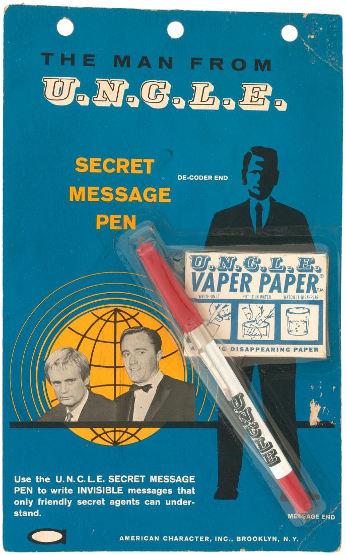 "THE MAN FROM U.N.C.L.E. SECRET MESSAGE PEN & U.N.C.L.E: 6-5/8x10.5" photo-illustrated card contains 6" long pen w/"UNCLE" name on side and packet of "U.N.C.L.E. Vapor Paper" which was used to write secret messages; "Write On It, Put It In Water, Watch It D