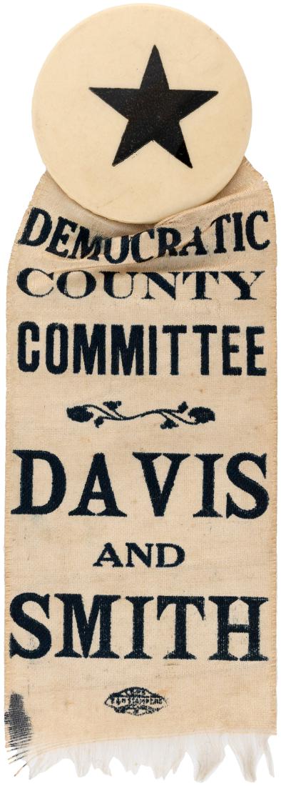JOHN W. DAVIS AND AL SMITH NEW YORK COATTAIL RIBBON.: JOHN W. DAVIS AND AL SMITH NEW YORK COATTAIL RIBBON. 1.75" button w/"BIM The Button And Badge Man" back paper. Ribbon reads "Democratic County Committee Davis And Smith." 1924. A less than .25x.75" in