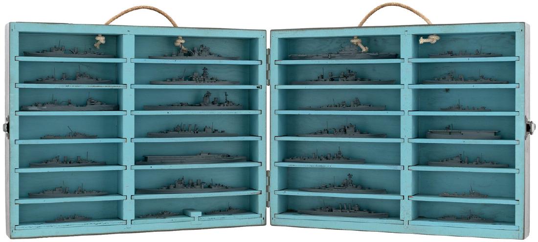 WORLD WAR II "U.S. NAVY MINIATURE BRITISH SHIP MODELS": WORLD WAR II "U.S. NAVY MINIATURE BRITISH SHIP MODELS" SET IN SELF-CONTAINED WOOD DISPLAY CASE. 13.5x17x4" deep wooden hinged lid case w/cord handles and stenciled "U.S. Navy Miniature British Ship Mo