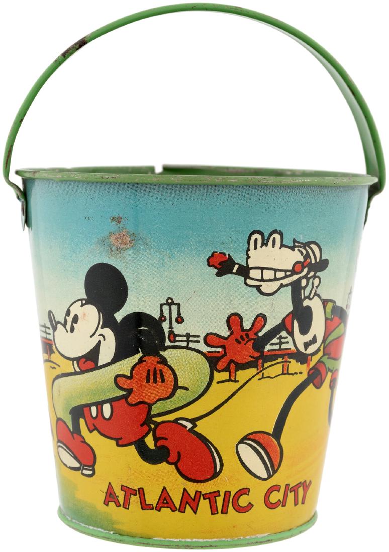 MICKEY MOUSE & FRIENDS RARE "ATLANTIC CITY" SMALL SAND: MICKEY MOUSE & FRIENDS RARE "ATLANTIC CITY" SMALL SAND PAIL. 4.25" tall (6.5" tall to top of raised handle) tin litho. Ohio Art, 1930s. Sides feature great beach scene of Mickey Mouse wearing an inner
