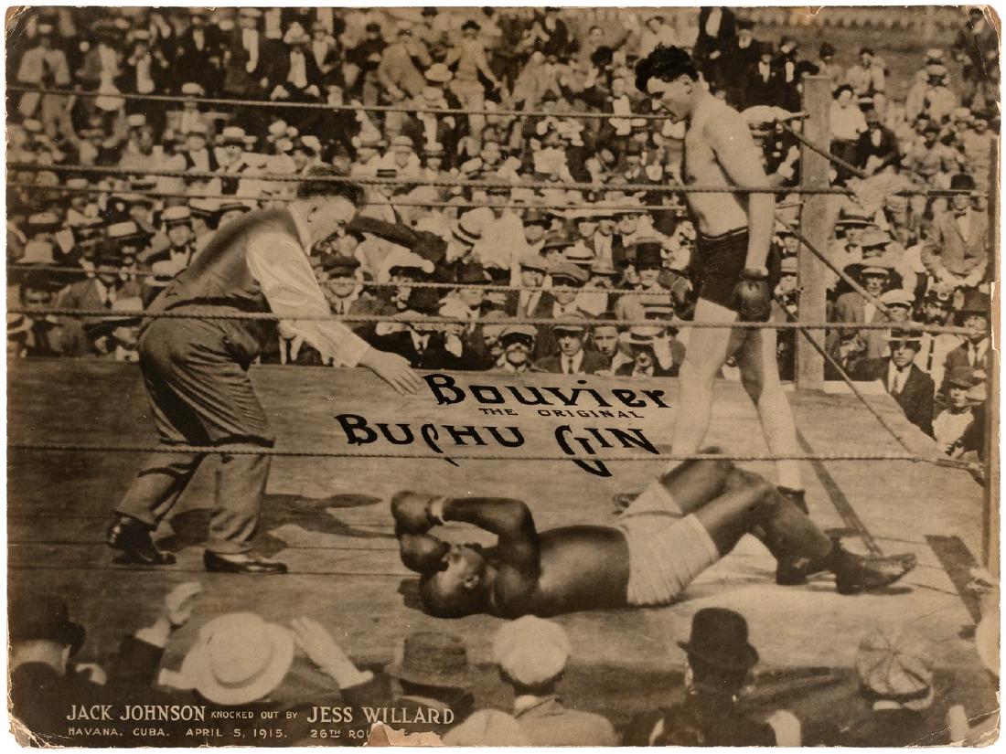 JACK JOHNSON VS. JESS WILLARD "BOUVIER GIN" ADVERTISING: 14-5/8x19-5/8" thick cardboard sign features photo image from April 5, 1915 boxing match that took place in Havana, Cuba, between then World Heavyweight Champion Jack Johnson and Jess Willard, which s
