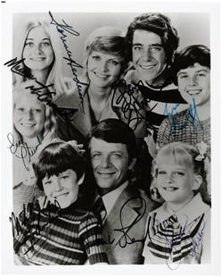 "THE BRADY BUNCH" CAST-SIGNED PHOTO INCLUDING ROBERT: Glossy 8x10" photo shows the cast of the popular ABC sitcom and has been signed by all eight shown. Florence Henderson (1934-2016), Robert Reed (1932-1992), Maureen McCormick, Barry Williams, Eve Plum