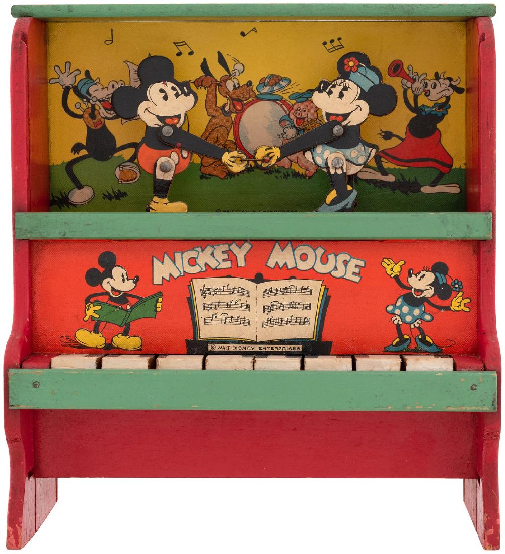 "MICKEY MOUSE" PIANO WITH DANCING MICKEY & MINNIE MOUSE: 5x9.5x10" tall wooden toy piano. Marks Bros. ©1936 WDE stamp on back of piano. Complete w/separate attached pair of die-cut and jointed cardboard figures of Mickey and Minnie Mouse which dance as key
