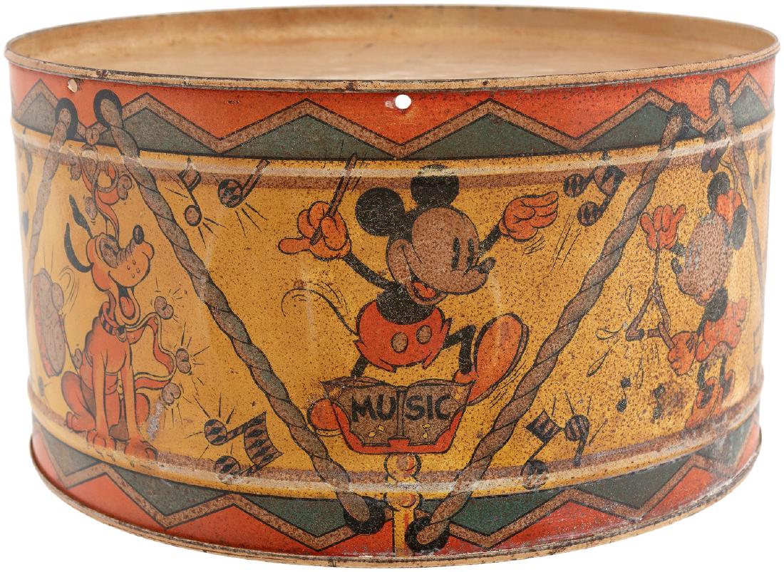 MICKEY MOUSE & FRIENDS HAPPYNAK TIN DRUM.: 5.5x10" dia. tin litho drum w/painted tin drumheads features great wraparound band scene w/Mickey and Minnie Mouse, Horace Horsecollar, Donald Duck, Goofy, Clarabelle Cow and Pluto. Made in England by