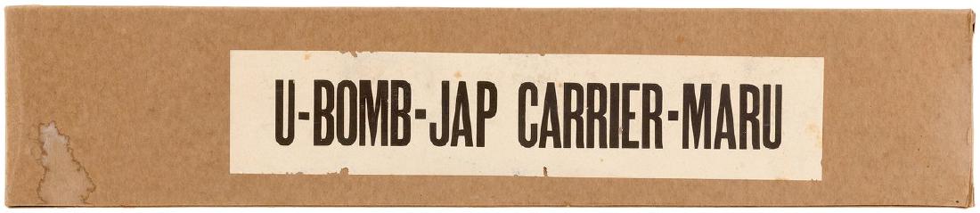 WW II "U-BOMB-JAP CARRIER-MARU" BOXED HOMEFRONT TOY.: WW II "U-BOMB-JAP CARRIER-MARU" BOXED HOMEFRONT TOY. Original box w/lid label w/bold "U-Bomb-Jap Carrier-Maru" text contains 17.5" long painted wood Japanese aircraft carrier toy. Released during the