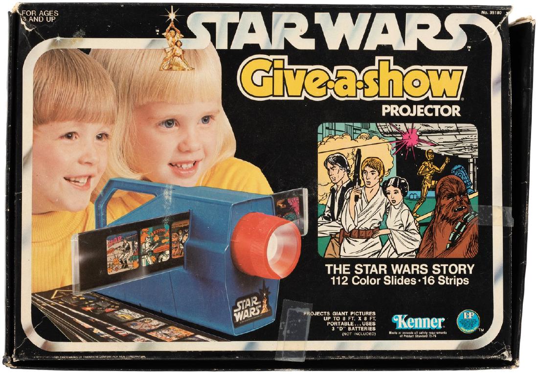 "STAR WARS & RETURN OF THE JEDI" GIVE-A-SHOW PROJECTOR: STAR WARS & RETURN OF THE JEDI GIVE-A-SHOW PROJECTOR BOXED PAIR. 3x9x13" pair of boxes contain Kenner "Give-a-show" projectors. First is ©1977 "Star Wars" edition. Used set has projector and film str