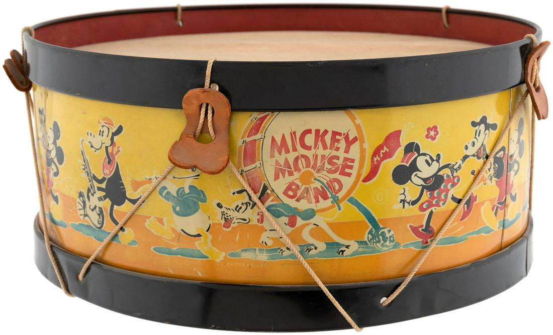 "MICKEY MOUSE BAND" DRUM (LARGEST SIZE VARIETY).: "MICKEY MOUSE BAND" DRUM (LARGEST SIZE VARIETY). 13" dia. by 5-7/8" tall; the largest of three sizes produced by Noble & Cooley, who produced many different Mickey Mouse toy instruments. 1930s. Tin li