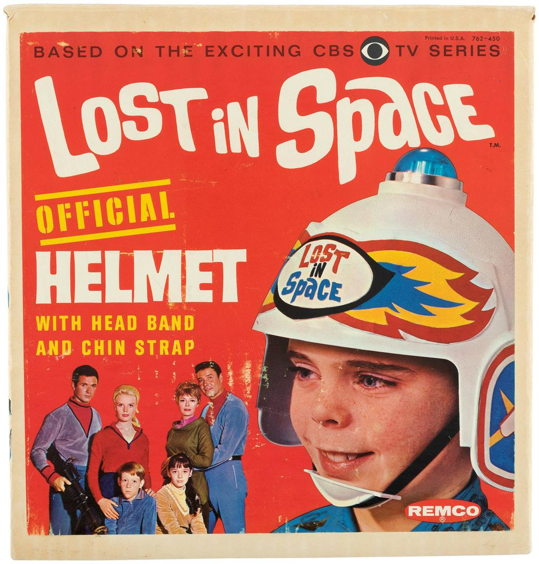 "LOST IN SPACE" BOXED REMCO HELMET.: "LOST IN SPACE" BOXED REMCO HELMET. 8.5x9x9.5" tall cardboard box w/photo-illustrated label contains 9" tall plastic helmet based on the 1965-1968 Sci-Fi CBS TV show. Remco, 1966. Box is evenly aged a