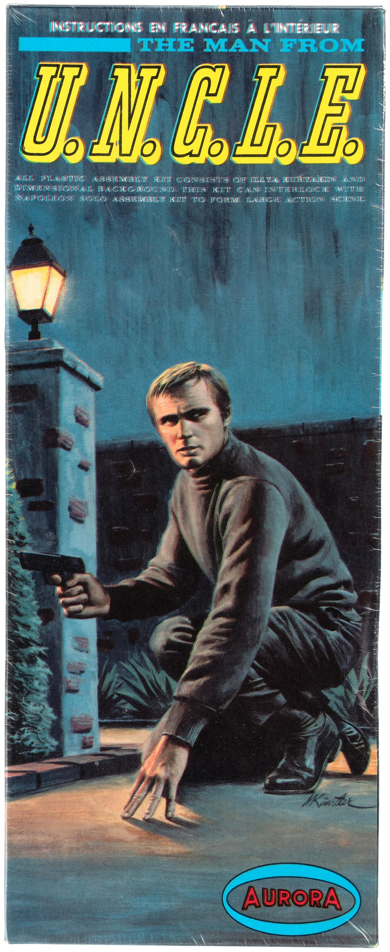 "THE MAN FROM U.N.C.L.E. - ILLYA KURYAKIN" BOXED AURORA: Kit No. 412-129. ©1966 MGM, Inc. Canadian issue. Model kit remains factory-sealed as issued. Box lid has slight inward warp w/some creasing at center right edge due to tightness of shrinkwrap, wh